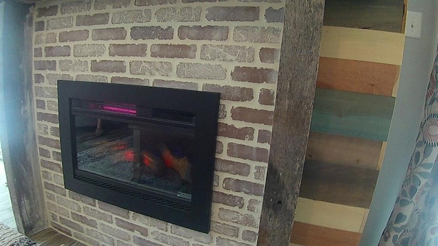 interior details with a brick fireplace