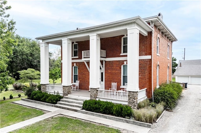 neoclassical home featuring covered porch