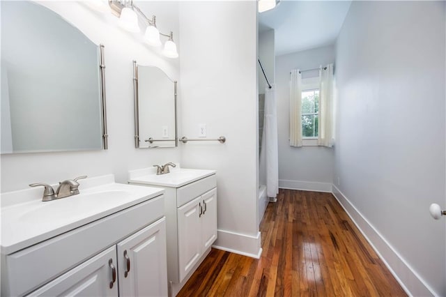 bathroom featuring vanity, hardwood / wood-style floors, and a shower with curtain