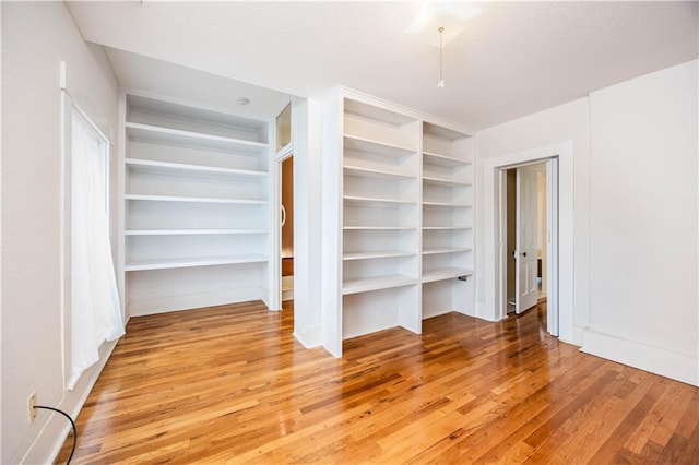 unfurnished bedroom featuring hardwood / wood-style flooring