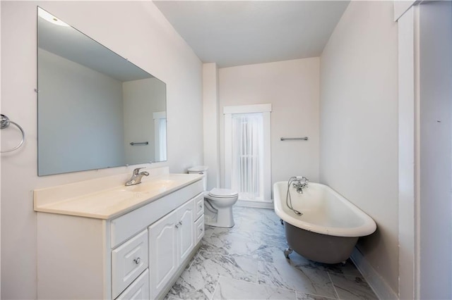 bathroom with a tub to relax in, toilet, and vanity