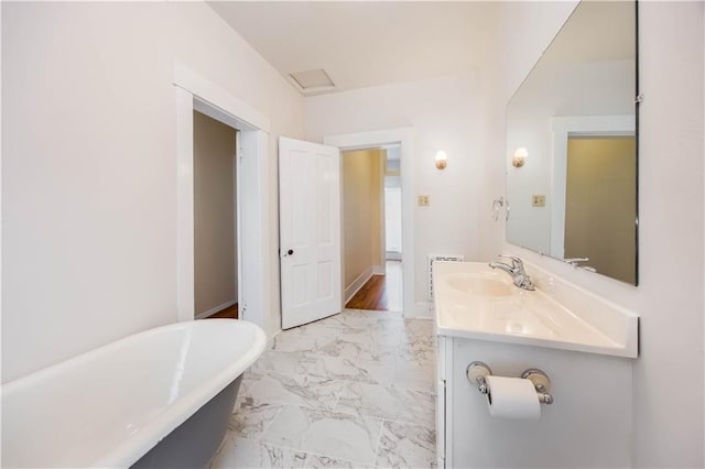 bathroom with a bathing tub and vanity