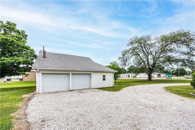 garage with a yard