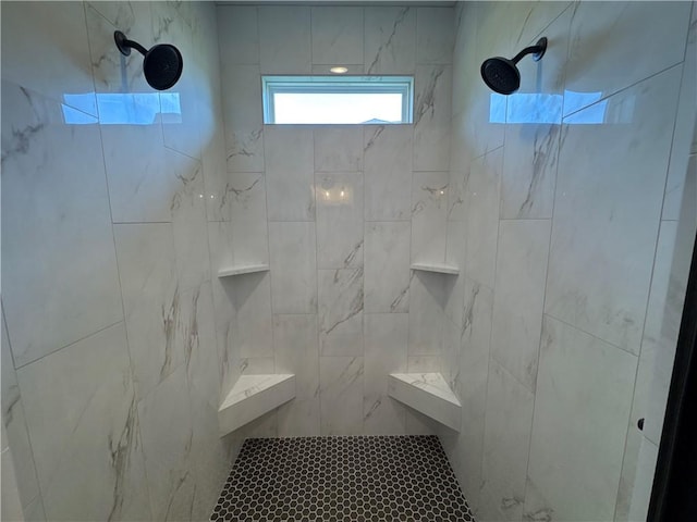 bathroom with a tile shower