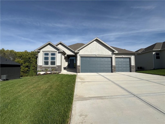 craftsman-style house featuring a front lawn and a garage