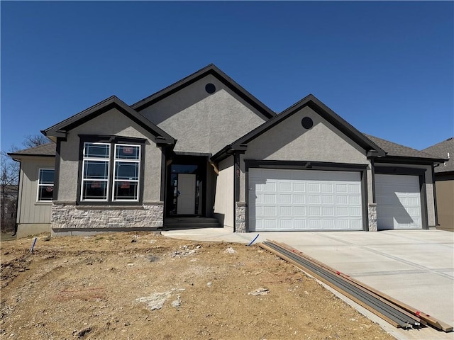 13503 NW Terrace Park Dr, Parkville, MO 64152 - view of front of home with stone siding, a garage, driveway, and stucco siding