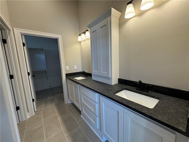 13503 NW Terrace Park Dr, Parkville, MO 64152 - full bathroom featuring double vanity, tile patterned flooring, and a sink