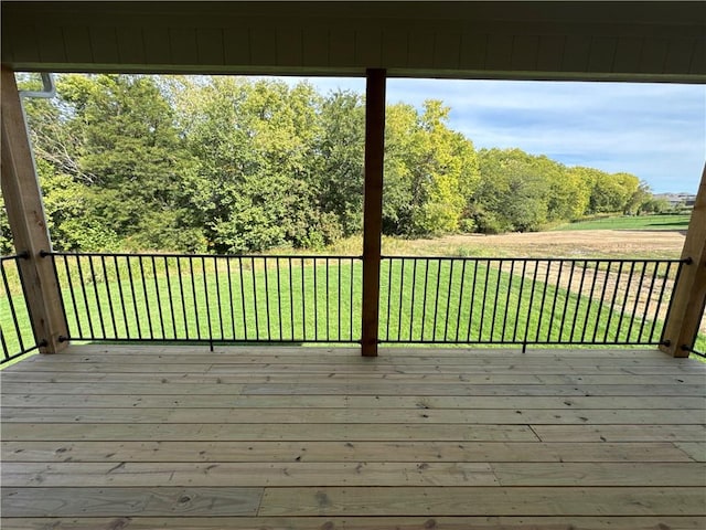 wooden deck with a yard