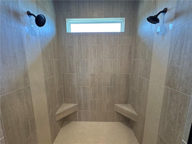 bathroom featuring a tile shower