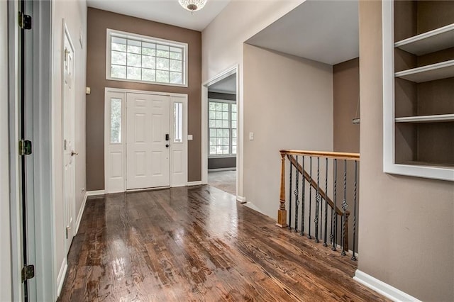 foyer entrance with dark wood-type flooring