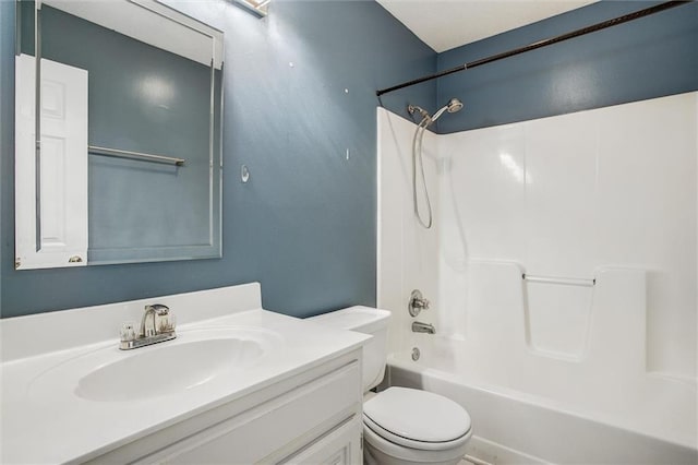 full bathroom featuring bathing tub / shower combination, vanity, and toilet