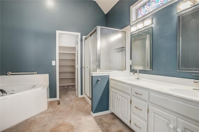 bathroom with vanity, separate shower and tub, and lofted ceiling