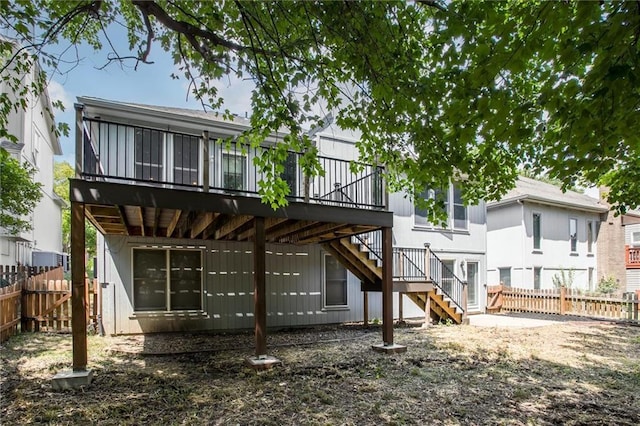 rear view of property with a wooden deck