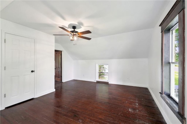 additional living space with vaulted ceiling, ceiling fan, and dark hardwood / wood-style floors