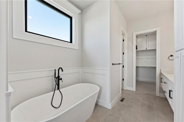 bathroom with a bath and vanity