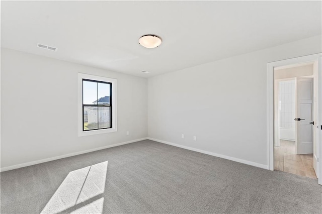 unfurnished room with carpet floors