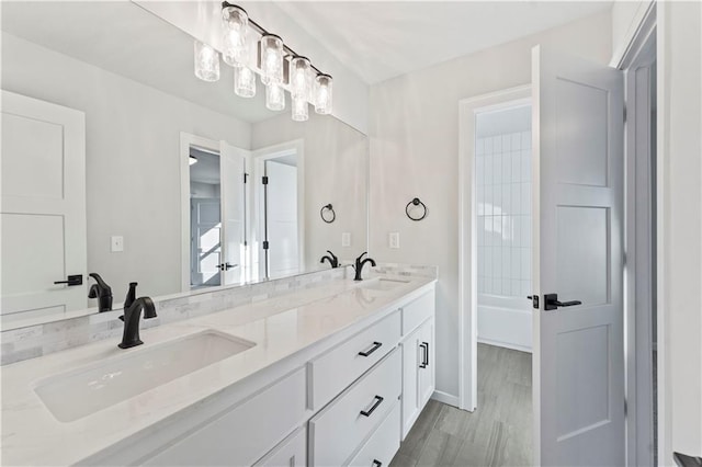 bathroom featuring vanity and hardwood / wood-style flooring