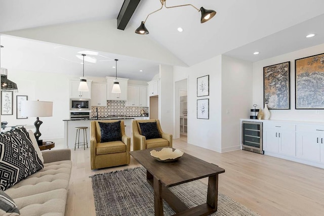 living room with high vaulted ceiling, beamed ceiling, wine cooler, bar, and light wood-type flooring