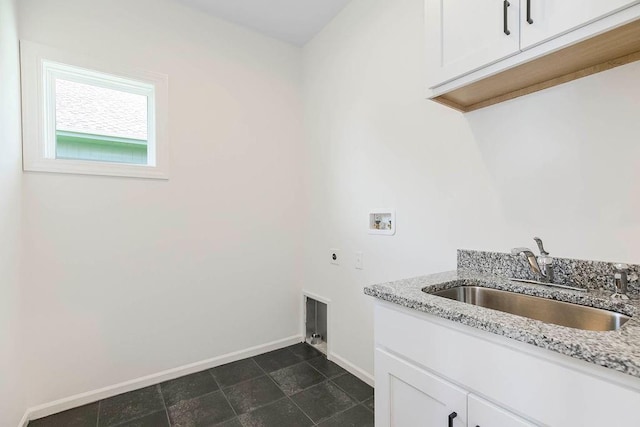 laundry area with cabinets, electric dryer hookup, sink, and washer hookup