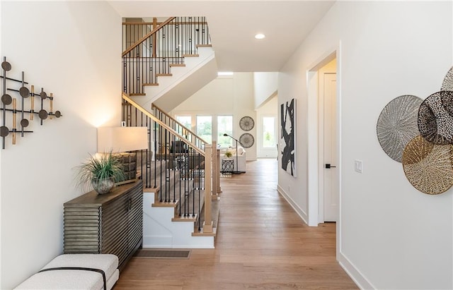 hall with hardwood / wood-style flooring