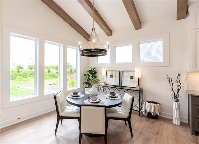 dining room featuring vaulted ceiling with beams, light wood-type flooring, and a notable chandelier