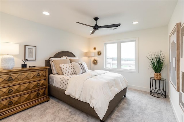 bedroom featuring ceiling fan and light colored carpet