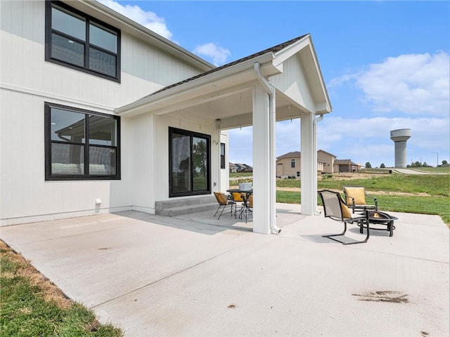 view of patio with a fire pit