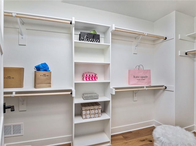 walk in closet featuring hardwood / wood-style floors