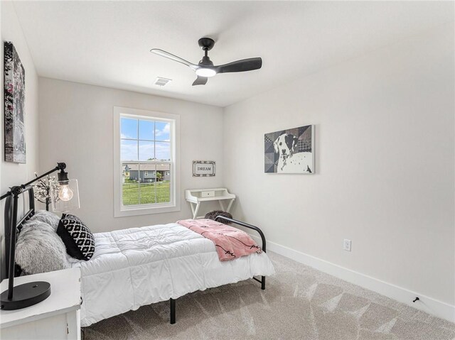 bedroom with ceiling fan and carpet flooring