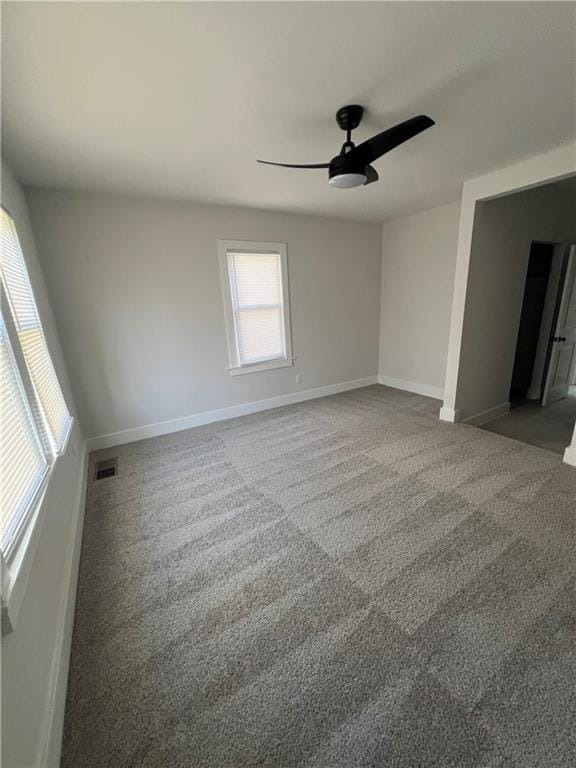 unfurnished bedroom featuring carpet and ceiling fan