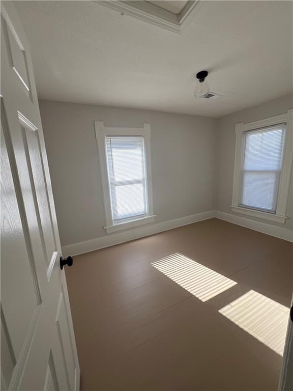 unfurnished room with hardwood / wood-style flooring