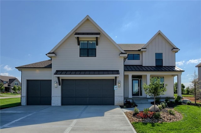 modern inspired farmhouse with a standing seam roof, concrete driveway, board and batten siding, and brick siding