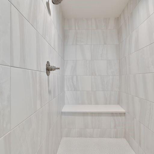 bathroom featuring a tile shower