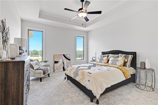 13028 S Constance St, Olathe, KS 66062 - carpeted bedroom with a tray ceiling and ceiling fan