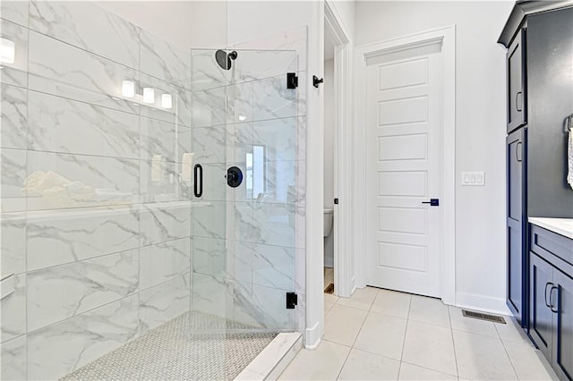 13028 S Constance St, Olathe, KS 66062 - bathroom with a marble finish shower, vanity, and tile patterned flooring
