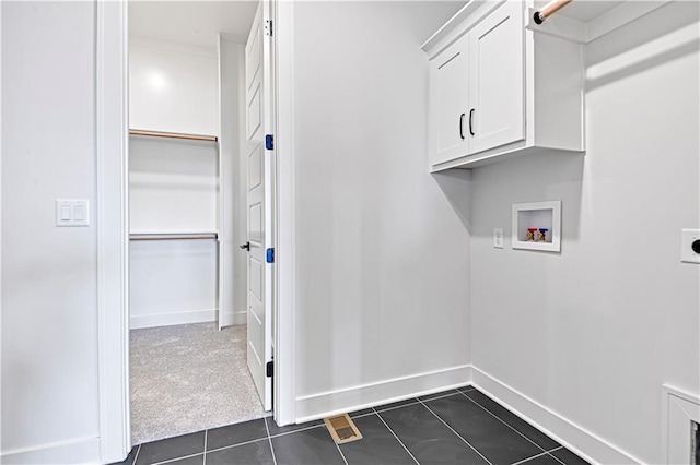 13028 S Constance St, Olathe, KS 66062 - washroom featuring cabinet space, hookup for a washing machine, dark tile patterned flooring, and hookup for an electric dryer