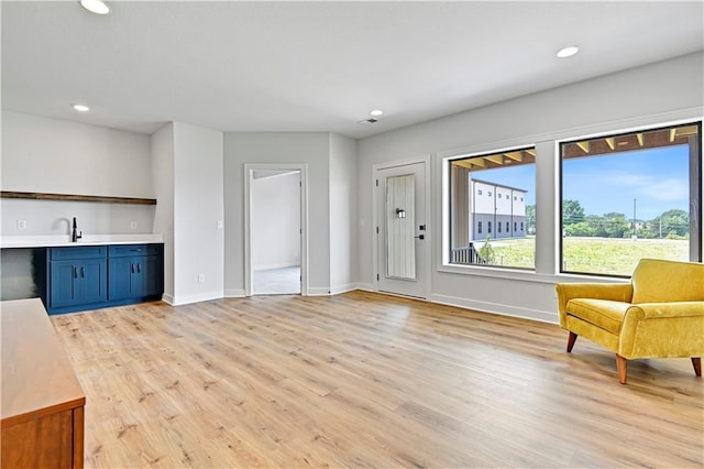 13028 S Constance St, Olathe, KS 66062 - living area with light wood-style floors and recessed lighting