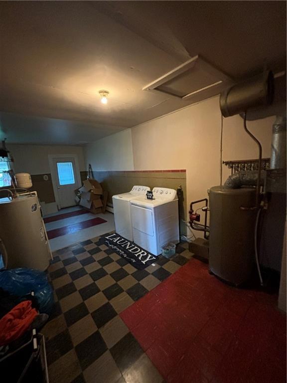 303 N Cayuga St, Frontenac, KS 66763 - laundry area featuring tile patterned floors, gas water heater, washer and dryer, and attic access