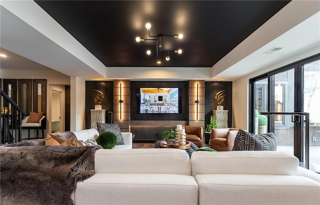 cinema featuring a tray ceiling