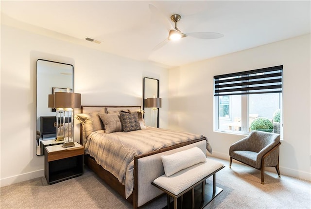 bedroom featuring light carpet and ceiling fan