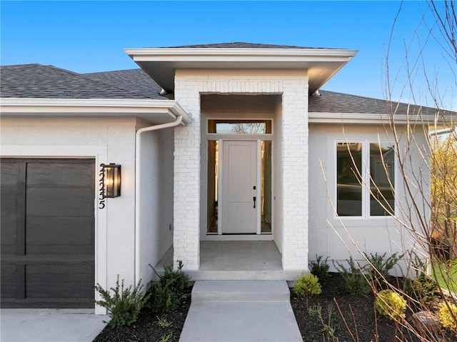 doorway to property featuring a garage