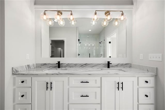 bathroom featuring vanity and an enclosed shower