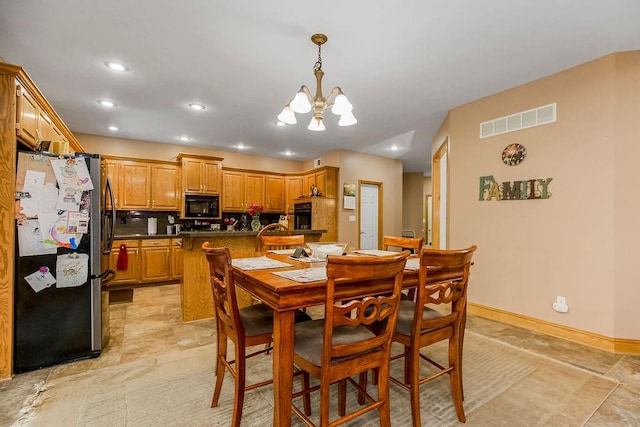 dining area with a notable chandelier