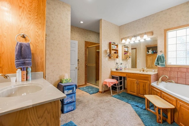 bathroom with independent shower and bath and vanity