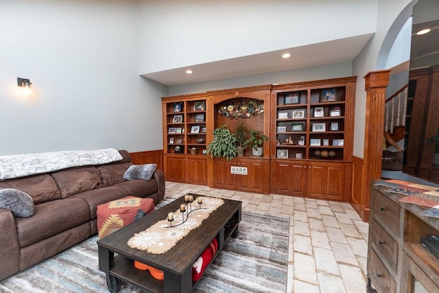 living room featuring a high ceiling