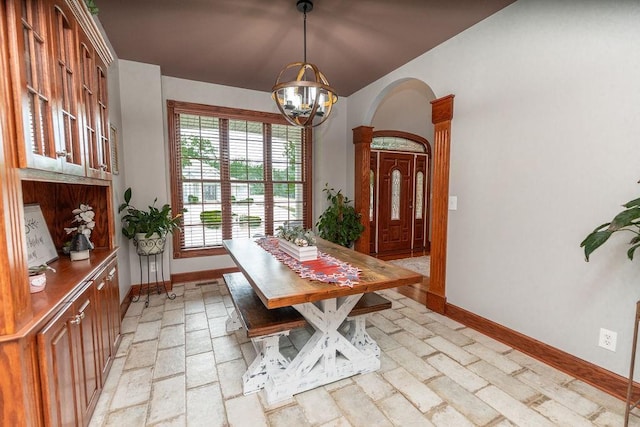 unfurnished dining area featuring a chandelier