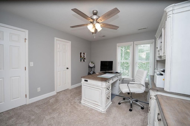 office area with ceiling fan and light carpet