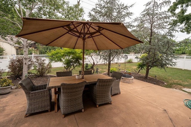 view of patio / terrace featuring an outdoor fire pit