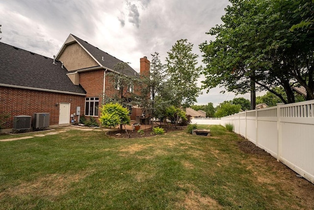 view of yard featuring central AC