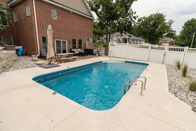 view of swimming pool with a patio area